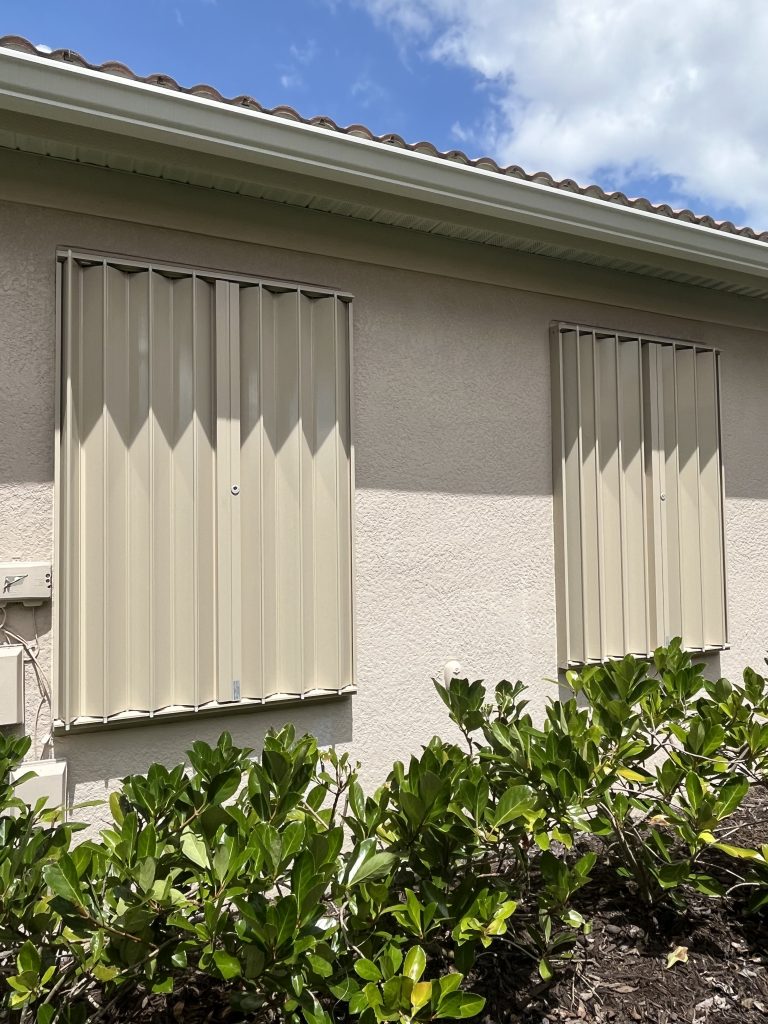 Beige Accordion Hurricane Shutter