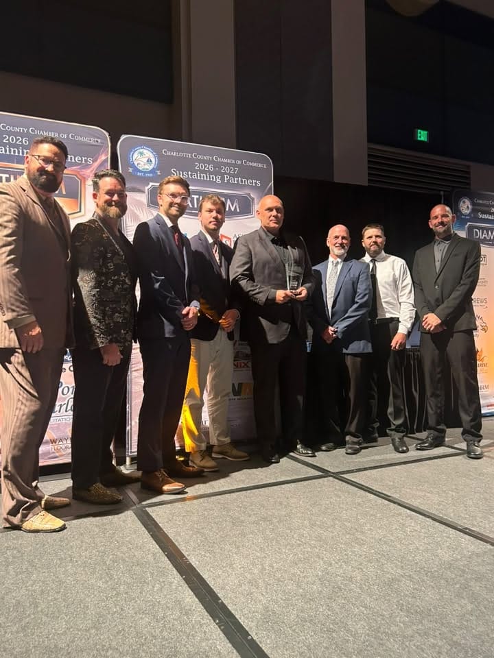 Chris Hege and the Elite Hurricane Protection team receiving the 2026 Charlotte County Chamber of Commerce Small Business of the Year Award
