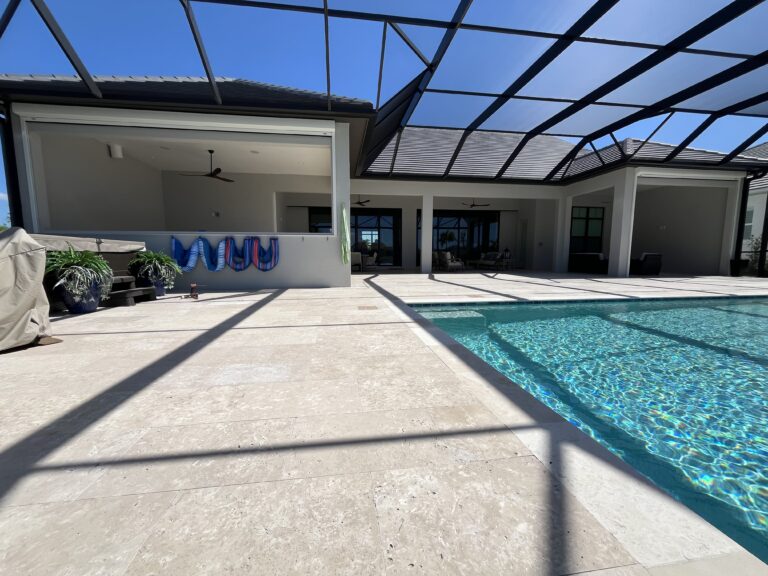 Motorized hurricane screen across a large poolside lanai open